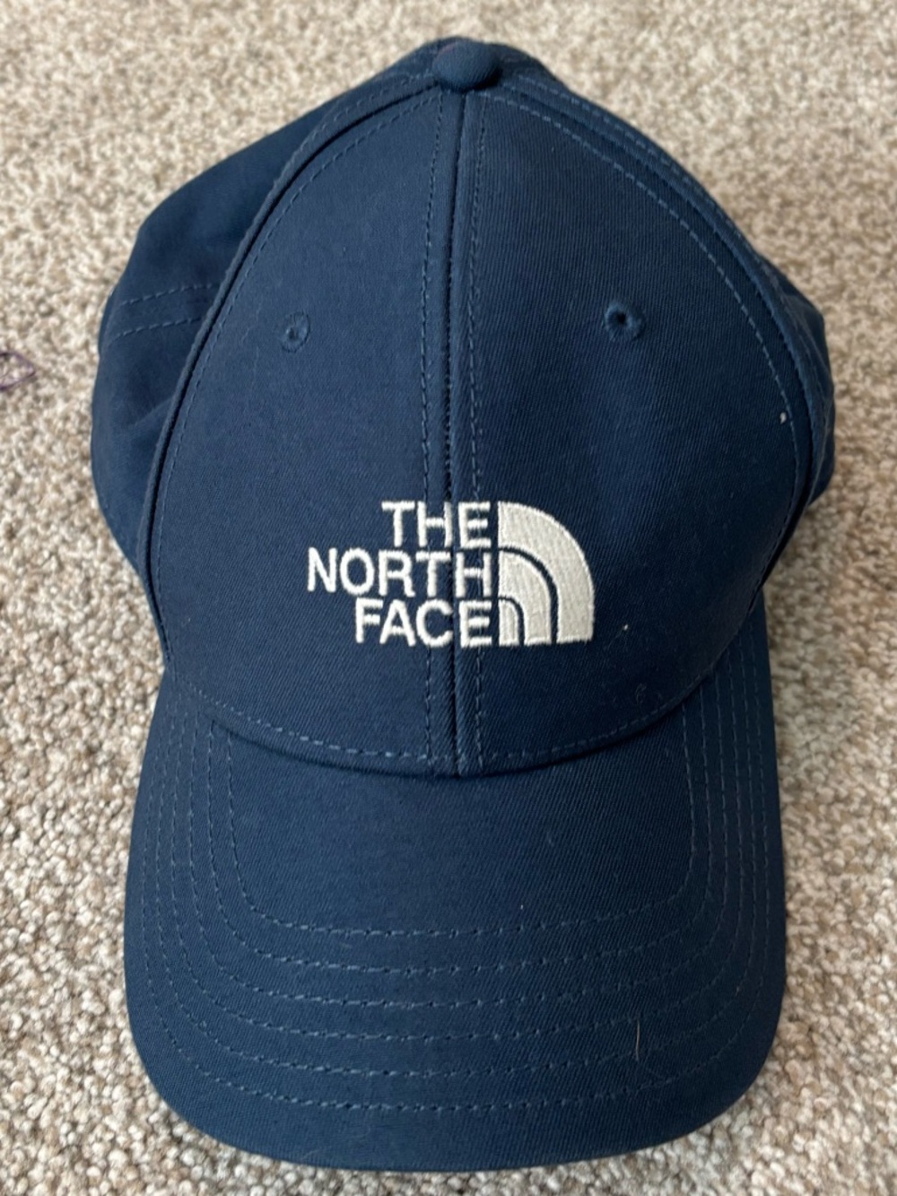 The North Face Navy Baseball Cap with White Logo